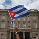 A supporter waves a Cuban flag in front of the country’s embassy after it reopened for the first time in 54 years July 20, 2015, in Washington, D.C.
Mark Wilson/Getty Images